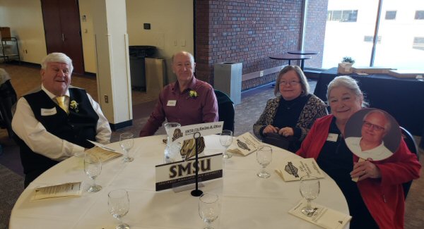 2026-01-24-Luncheon-table-picture-with-brian-luke-sign.jpg