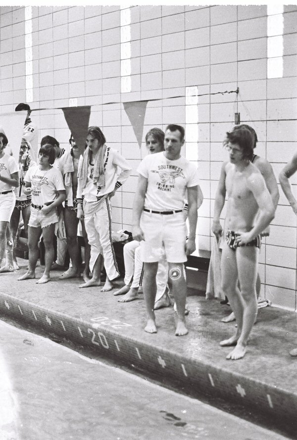2026-04-01-Coach-Palm-and-swimmers-on-deck.jpg