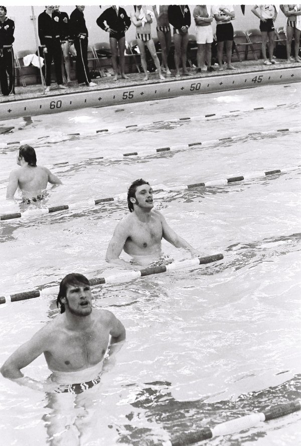 2026-04-01-swimmers-looking-at-clock.jpg